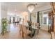 Dining room area featuring chandelier and access to other rooms at 8824 Killians Greens Dr, Las Vegas, NV 89131
