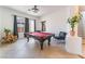 Well-lit game room with a pool table, neutral walls, and stylish furniture at 8824 Killians Greens Dr, Las Vegas, NV 89131