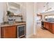 Kitchenette area with granite countertops, wine cooler, and coffee maker at 8824 Killians Greens Dr, Las Vegas, NV 89131