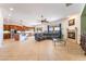 Spacious living room featuring a fireplace, tile flooring, and lots of natural light at 8824 Killians Greens Dr, Las Vegas, NV 89131