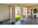 Covered patio space with a view of an artificial grass lawn at 8824 Killians Greens Dr, Las Vegas, NV 89131