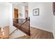 Staircase landing featuring wood floors and views to the entry and downstairs at 8824 Killians Greens Dr, Las Vegas, NV 89131