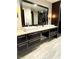 Stylish bathroom featuring double vanity with vessel sinks and a large mirror at 8925 W Flamingo Rd # 319, Las Vegas, NV 89147