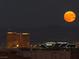 View of the Las Vegas skyline featuring Mandalay Bay, Allegiant Stadium and a full moon at 8925 W Flamingo Rd # 319, Las Vegas, NV 89147