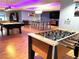 Game room featuring a foosball table, pool table, bar seating and a television at 8925 W Flamingo Rd # 319, Las Vegas, NV 89147