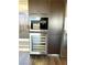 Gourmet kitchen featuring built-in appliances including a wine refrigerator and coffee maker at 8925 W Flamingo Rd # 319, Las Vegas, NV 89147