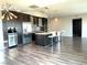 Modern kitchen with stainless steel appliances, island with seating, and stylish backsplash at 8925 W Flamingo Rd # 319, Las Vegas, NV 89147