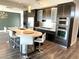 Open kitchen featuring sleek countertops, stainless steel appliances, and island with seating at 8925 W Flamingo Rd # 319, Las Vegas, NV 89147