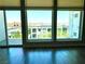 Living room featuring large windows with views of the city and surrounding neighborhood at 8925 W Flamingo Rd # 319, Las Vegas, NV 89147