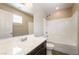 A well-lit bathroom with sink, toilet, and shower-tub combination at 9050 W Tropicana Ave # 1017, Las Vegas, NV 89147