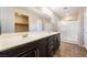 Double sink bathroom with modern cabinetry and a glass-enclosed shower, maximizing space and style at 9050 W Tropicana Ave # 1017, Las Vegas, NV 89147