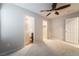A sun-filled bedroom with plush carpet and connections to the bathroom and walk-in closet at 9050 W Tropicana Ave # 1017, Las Vegas, NV 89147