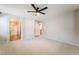 Expansive bedroom with soft carpeting and multiple doorways leading to ensuite bathroom and walk-in closet at 9050 W Tropicana Ave # 1017, Las Vegas, NV 89147