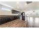 Open kitchen design with granite countertops, dark wood cabinetry, and stainless steel appliances for modern living at 9050 W Tropicana Ave # 1017, Las Vegas, NV 89147