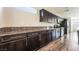 Modern kitchen featuring granite countertops, stainless steel appliances, and ample cabinet space at 9050 W Tropicana Ave # 1017, Las Vegas, NV 89147