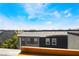 A rooftop view of a home showcasing the tile roof and the surrounding neighborhood at 9050 W Tropicana Ave # 1017, Las Vegas, NV 89147