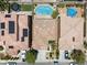 This aerial view shows two backyards, one with a round pool and one with an inground pool at 9074 Iron Cactus Ave, Las Vegas, NV 89148