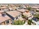 Aerial view of neighborhood showcasing consistent architecture, desert landscaping, and neatly manicured lawns at 9074 Iron Cactus Ave, Las Vegas, NV 89148