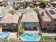 Aerial shot of home featuring a private swimming pool, patio, and residential neighborhood at 9074 Iron Cactus Ave, Las Vegas, NV 89148