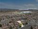 An aerial view of a home in relation to the nearby school, residential neighborhood and the Las Vegas strip at 9074 Iron Cactus Ave, Las Vegas, NV 89148