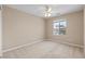 Bedroom featuring neutral paint, carpet, window and a ceiling fan at 9074 Iron Cactus Ave, Las Vegas, NV 89148