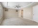 Spacious bedroom with carpet, tray ceilings, and an ensuite bathroom at 9074 Iron Cactus Ave, Las Vegas, NV 89148