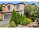 Charming two-story home featuring a two-car garage and beautiful desert landscaping at 9074 Iron Cactus Ave, Las Vegas, NV 89148