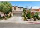 Charming home with manicured landscaping, mature trees, and a spacious two-car garage at 9074 Iron Cactus Ave, Las Vegas, NV 89148