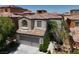 Exterior facade with a two-car garage, and tiled roof at 9074 Iron Cactus Ave, Las Vegas, NV 89148