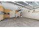 The garage provides ample space, storage cabinets, and hanging storage for organization at 9074 Iron Cactus Ave, Las Vegas, NV 89148