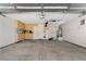 Well-organized garage featuring storage cabinets, hanging racks and clean epoxy flooring at 9074 Iron Cactus Ave, Las Vegas, NV 89148