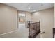 Second floor hallway with carpet and view into another room at 9074 Iron Cactus Ave, Las Vegas, NV 89148