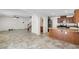 Open-concept living area with archways, tile flooring, and view into the kitchen at 9074 Iron Cactus Ave, Las Vegas, NV 89148