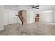 Open-concept space with tile floors, staircase, and access to the kitchen at 9074 Iron Cactus Ave, Las Vegas, NV 89148