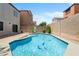 Inviting backyard pool with refreshing blue water and lovely landscaping offers a private outdoor oasis at 9074 Iron Cactus Ave, Las Vegas, NV 89148