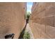 A side yard offers secure gated access to the back at 9074 Iron Cactus Ave, Las Vegas, NV 89148