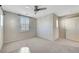 Bedroom with plantation shutters offering natural light, and a ceiling fan at 9542 Ridgeglen Ct, Las Vegas, NV 89148