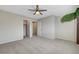 Light-filled bedroom with neutral carpet, ceiling fan, and access to the closet at 9542 Ridgeglen Ct, Las Vegas, NV 89148
