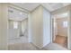 Upstairs hallway with views of the bedrooms and bathrooms and plush neutral carpet at 9542 Ridgeglen Ct, Las Vegas, NV 89148