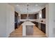 Modern kitchen with stainless steel appliances, an island, and dark wood cabinets at 9542 Ridgeglen Ct, Las Vegas, NV 89148