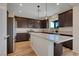 Modern kitchen with stainless steel appliances, an island, and dark wood cabinets at 9542 Ridgeglen Ct, Las Vegas, NV 89148