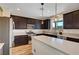 Spacious kitchen with modern appliances, dark cabinets, and large island at 9542 Ridgeglen Ct, Las Vegas, NV 89148