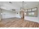 Large living room featuring recessed lights, ceiling fan, wood-look flooring, and a staircase at 9542 Ridgeglen Ct, Las Vegas, NV 89148