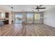 Spacious living room featuring hardwood floors, natural light, and a view of the pool at 9542 Ridgeglen Ct, Las Vegas, NV 89148