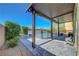 Covered patio overlooking a sparkling pool, perfect for outdoor entertaining and relaxation at 9542 Ridgeglen Ct, Las Vegas, NV 89148