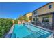 Backyard features a private pool, spa, and covered patio, perfect for relaxation at 9542 Ridgeglen Ct, Las Vegas, NV 89148