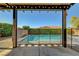 Inviting backyard pool enclosed with a fence, offering a refreshing oasis for relaxation and enjoyment at 9542 Ridgeglen Ct, Las Vegas, NV 89148