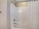Clean and functional shower featuring a white tile surround, shower curtain and chrome fixtures at 9542 Ridgeglen Ct, Las Vegas, NV 89148