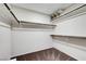 Organized walk-in closet features built-in shelving and hanging racks for ample storage space at 9542 Ridgeglen Ct, Las Vegas, NV 89148
