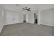 Bedroom featuring carpet, ceiling fan, walk in closet, and ensuite bath at 96 Saint Johns Wood Ave, Henderson, NV 89002